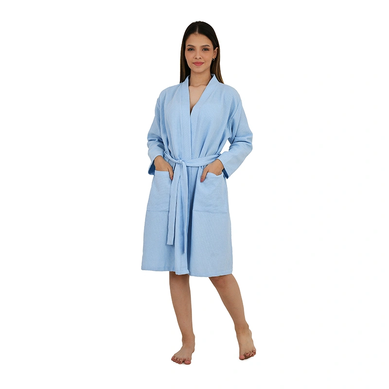 Light blue waffle-textured knee-length bathrobe with tie belt and front pockets - loungewear ecommerce photography by Lohar Studio Delhi